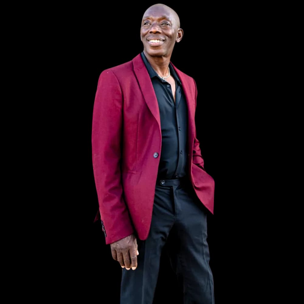 Michael Reid standing and smiling